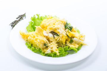 fried omelet with thin vermicelli with salad leaves in a plate