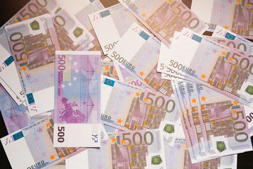 many lying scattered euro bills