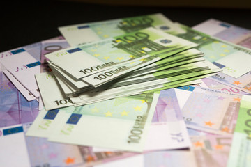 many lying scattered euro bills