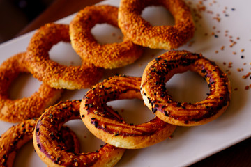 pastry rings consumed in holy days. special pastry cake for a holy day.
fresh sesame pastry rings in holy day.