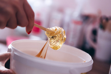 Wax honey for epilation, the process of epilation of parts of the female body by the method of shugaring