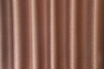 luxurious wavy brown fabric texture surface curtain wave with a pattern background. macro texture of brown striped fabric