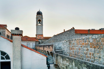 Belfry of Franciscan monastery and Old city walls of Dubrovnik