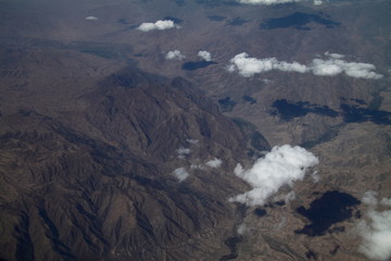 Mountains and sky landscape. Beauty atmosphere. View from the airplane. Arial view at the earth. Highest inspiration . Wallpaper and background.