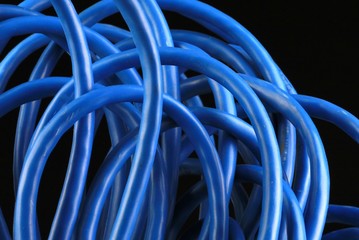 Messy roll of blue network cable - Powered by Adobe