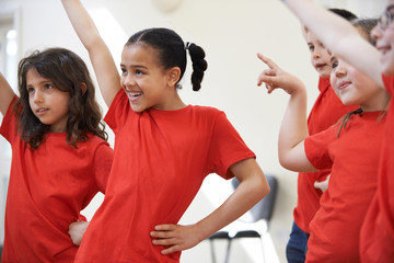 Group Of Children Enjoying Dance Class Together