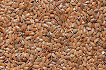 A solid background of peeled flaxseed