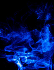 Blue smoke on black background