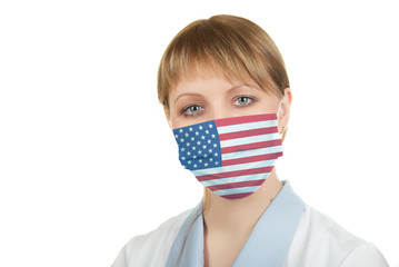 Closeup of a female healthcare professional nurse wearing a protection mask with USA flag