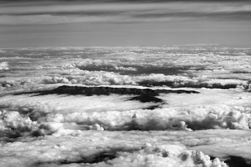 Top view on clouds and mountains
