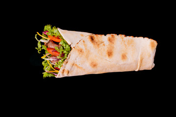 Delicious turkish doner kebab with beef grilled, onion, tomatoes, lettuce, parsley, carrot, ...
