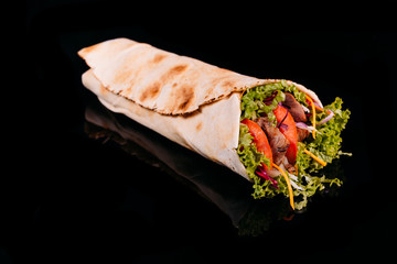 Delicious turkish doner kebab with beef grilled, onion, tomatoes, lettuce, parsley, carrot, ...