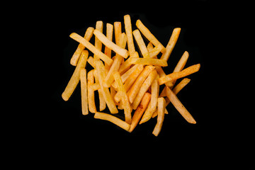 french fries isolated on black background