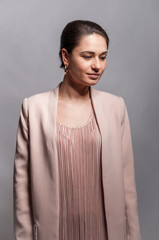 Beautiful young business girl is looking down and right