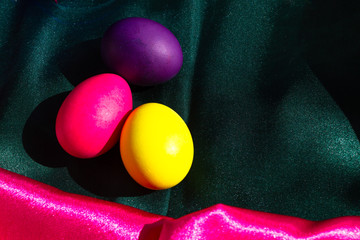 Painted Easter eggs in a nest of straw. Sunlight. Easter still life. - 336483023