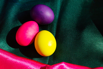Painted Easter eggs in a nest of straw. Sunlight. Easter still life. - 336483068