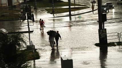 silhouette of a man walking on a bridge