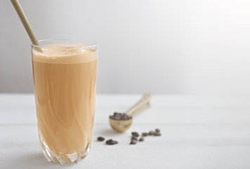 Cold coffee protein milkshake smoothie drink in a glass. collagen drink coffee flavored. healthy beverage for skin beauty and joints wealth. copy space.