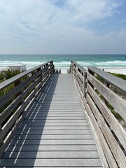 Obraz premium wooden bridge over the Gulf of Mexico water Florida beach