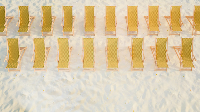 3D image front top view of sunbeds rows with yellow patterned fabric staying on the sand beach