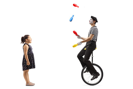 Girl Watching A Mime Juggling And Riding A Unicycle