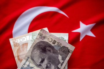 Close-up of Turkish Lira on Turkish Flag. Turkey's donation campaign for the Corona epidemic. 
