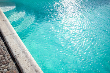 A Pool with steps near the sea. Travel vacation in the park. Vacation background.