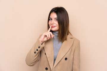 Young woman over isolated background doing silence gesture