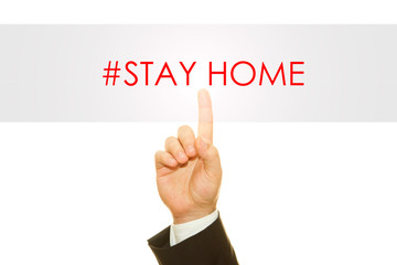 Businessman hand writing Stay Home message