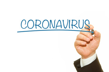 Businessman hand writing Coronavirus message.