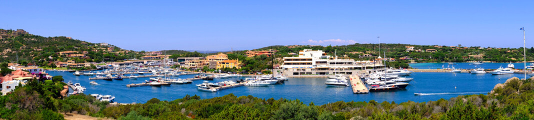 Fototapeta na wymiar Porto Cervo, Sardinia, Italy - Panoramic view of luxury yacht port and docking facilities in Porto Cervo resort at the Costa Smeralda coast of Tyrrhenian Sea