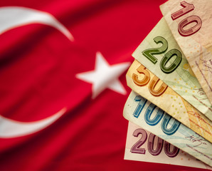 Close-up of Turkish Lira on Turkish Flag. Turkey's donation campaign for the Corona epidemic. We...