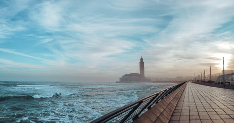 view of the Hassan II Mosque seen from the wall alley at sunrise - Casablanca, Morocco