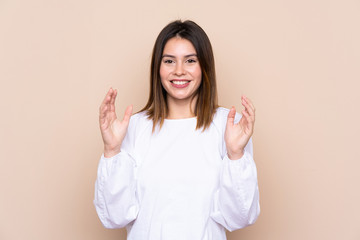 Young woman over isolated background laughing