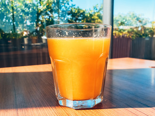 close up view of a glass of orange juice
