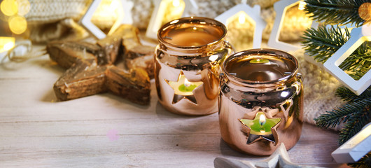 Cosy and soft winter background, knitted sweater and lights