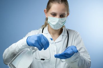 Anti-virus spray. The doctor sprays his hands with anti-virus spray.