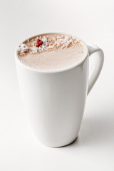 Craft latte coffee with coconut powder on top in white ceramic mug. White background. Best for commercial. Content for coffee addicted guys
