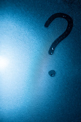 question mark on wet misted glass. copy space