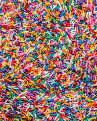 Fototapeta na wymiar Background abstract texture colorful sprinkles sugar candy macro