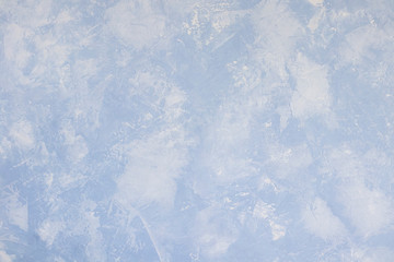 light blue textured background relief from putty