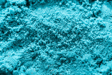 Abstract texture of the blue kinetic sand.