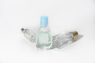 Perfume and aromatic oils on a white background. Perfumes and perfume making.