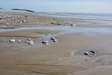 BARRY, VALE OF GLAMORGAN / WALES - APRIL 15 2020: elderly people take daily exercise in the sunshine during the COVID_19 lockdown making sure they are complying with social distance rules