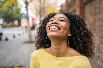 Portrait of Afro-american woman laughing.