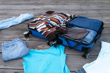 The wardrobe order. Cleaning things. Putting things in a suitcase. Preparing for the trip. Stop traveling. Stay at home. Concept.