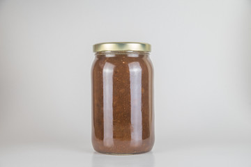 Cherry marmalade in jar, isolated on white