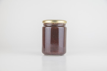 Canned tasty food - Jam jar on white colour background, close up studio object shot. Natural food and healty lyfestyle.