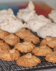 Passover (Pesach) baking - almond macaroon cookies and coconut meringue cakes, presented on a wire cooling tray.