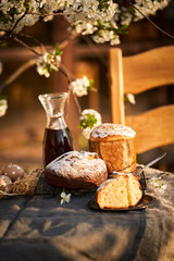 Traditional russian Easter cottage cheese dessert. Orthodox paskha, kulich cakes on table.